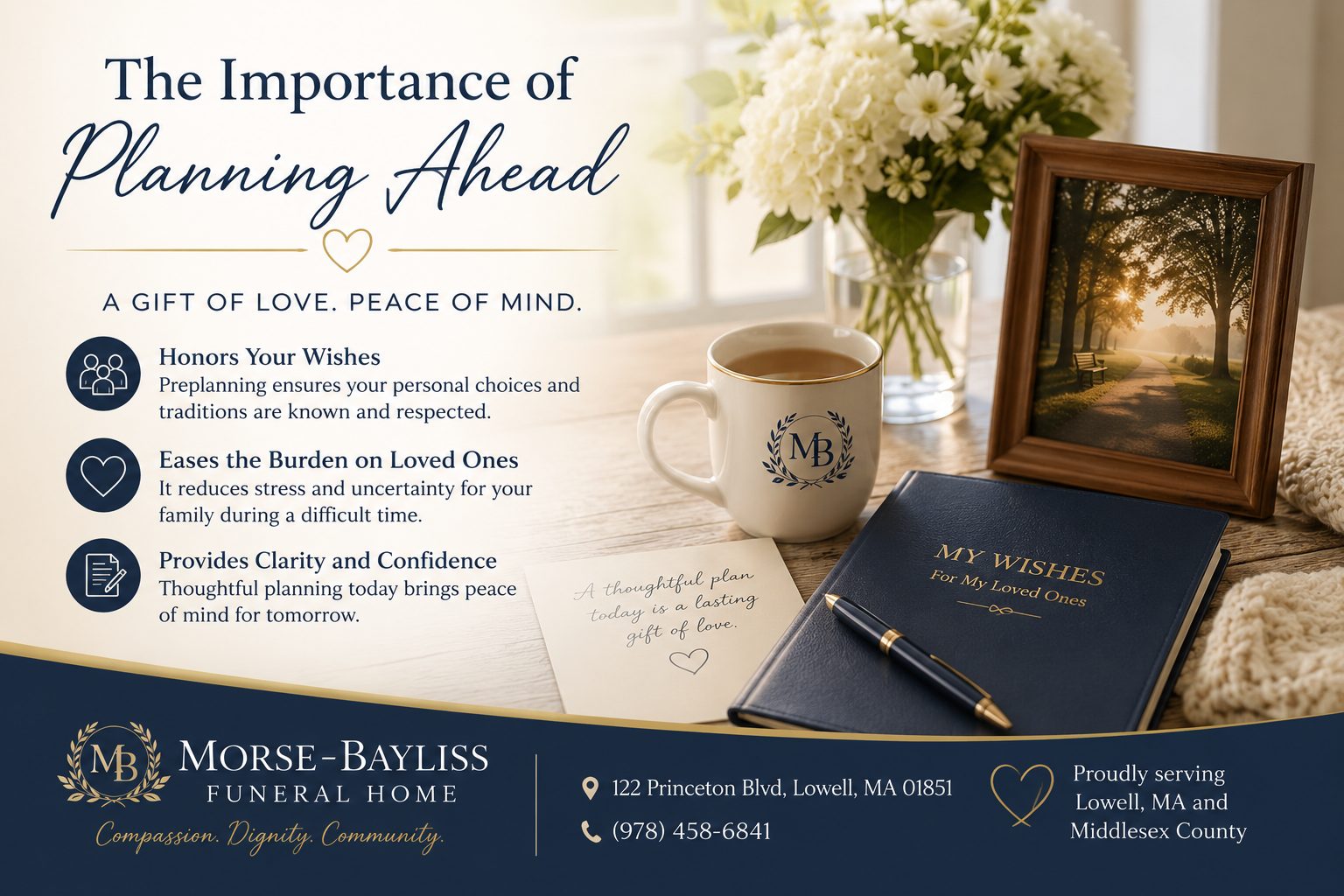 A calm tabletop arrangement with flowers, a candle, notebook, and framed photo